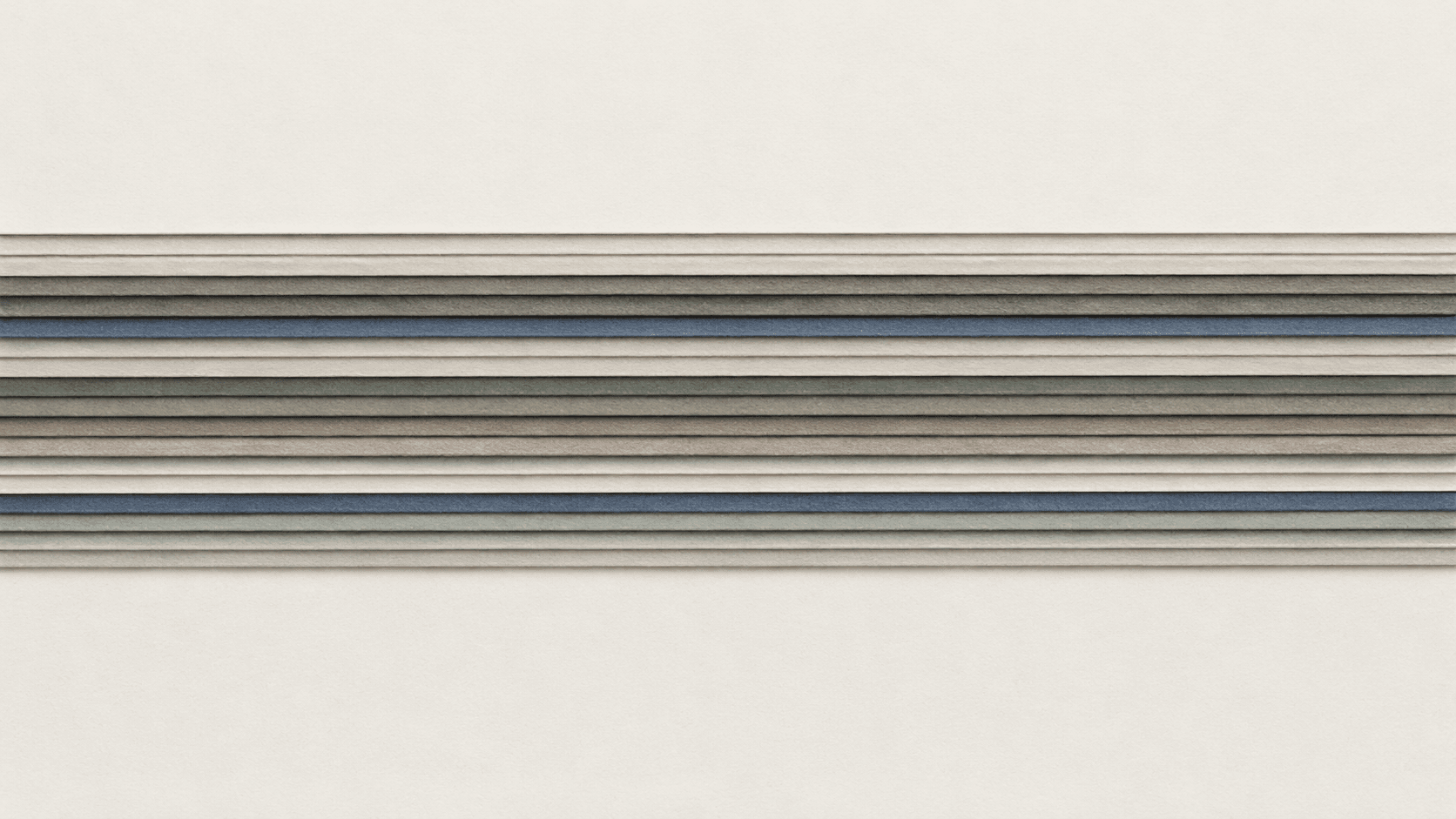 The stacked edges of many blank cards seen straight on, forming fine horizontal bands.
